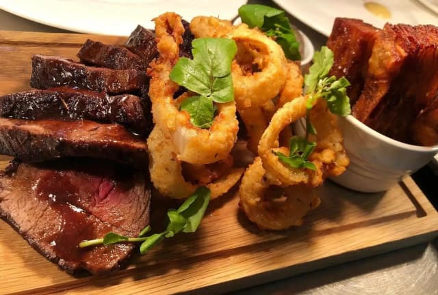 Sharing beef fillet, with pomme Anna chips, beer pickled onion rings and mushroom ketchup